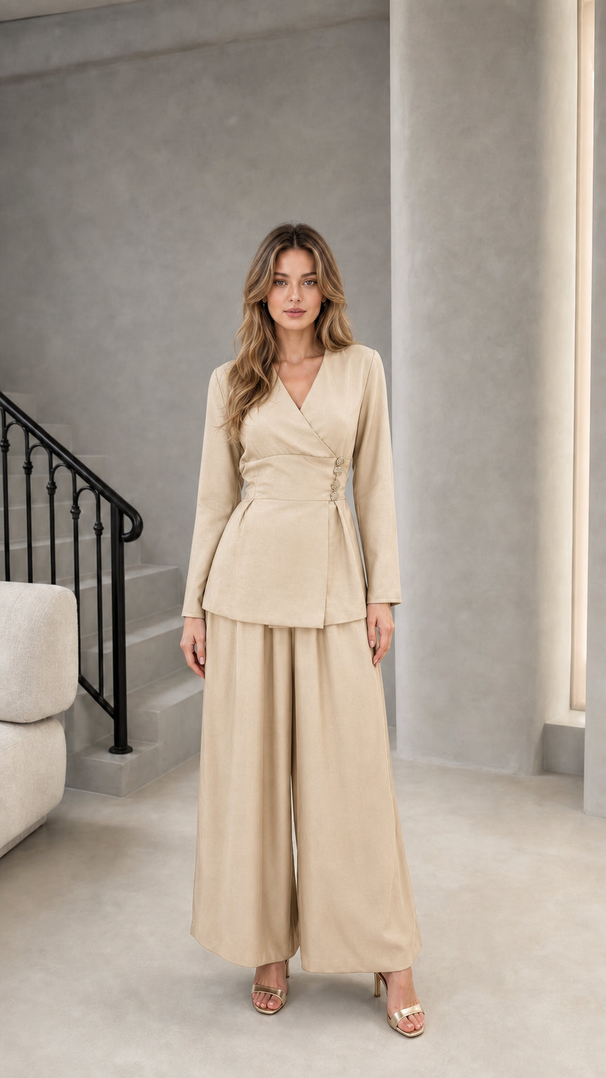 Model wearing beige champagne wrap blazer top and wide leg pants set