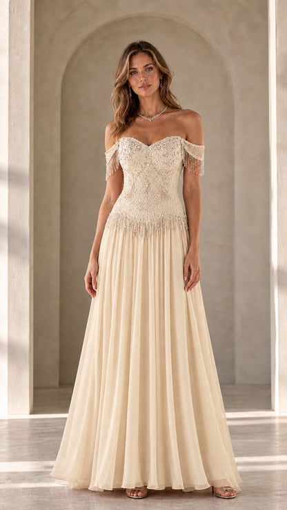 Model wearing champagne variant of the off-the-shoulder beaded evening gown