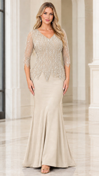 Woman wearing champagne beige embellished V-neck formal evening gown