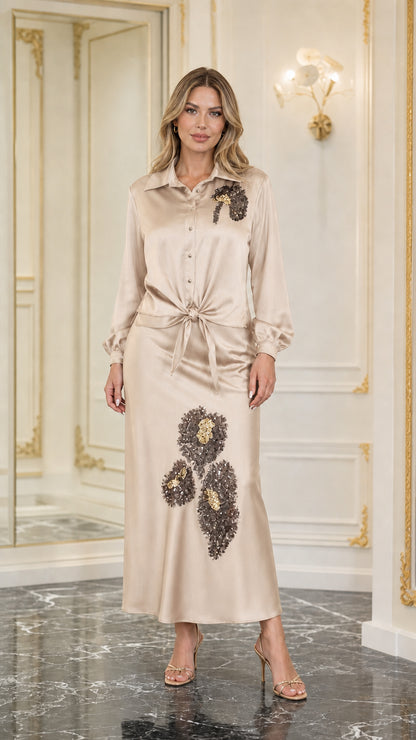 Model wearing champagne satin sequined two-piece set