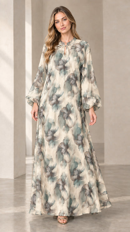 Front view of woman wearing cream and sage floral chiffon maxi dress