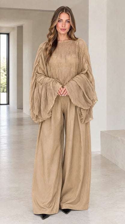 Front view of woman wearing khaki sheer pleated bell sleeve top and wide-leg pants set