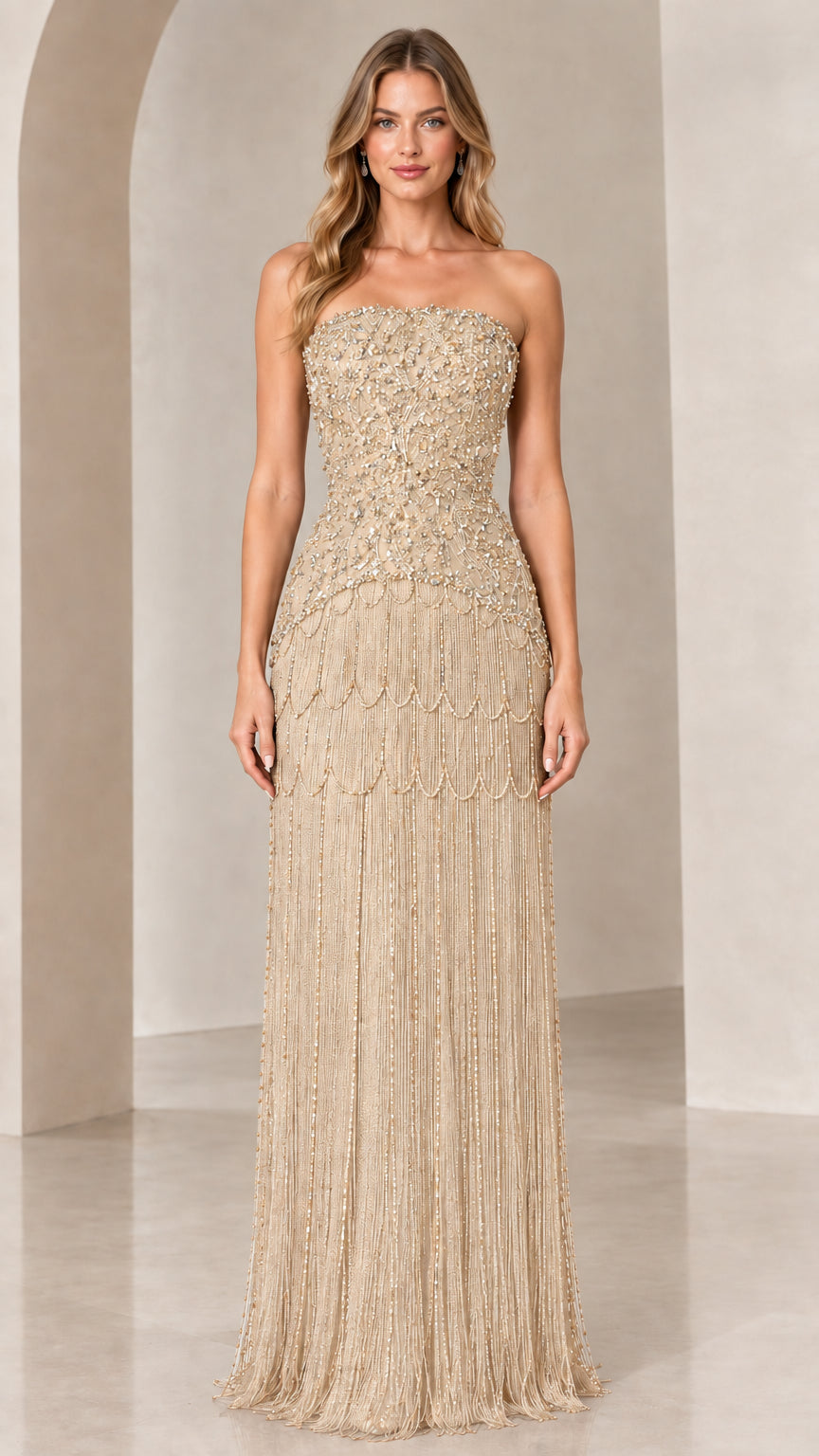 Front view of strapless beaded fringe evening gown in champagne