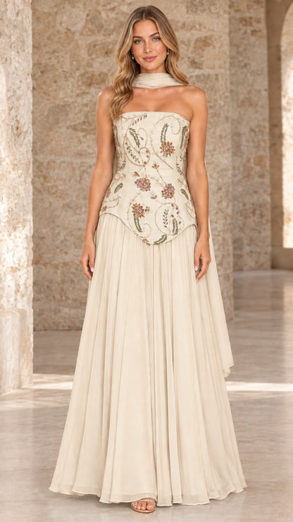 Front full view of champagne ivory strapless chiffon gown with embroidered bodice