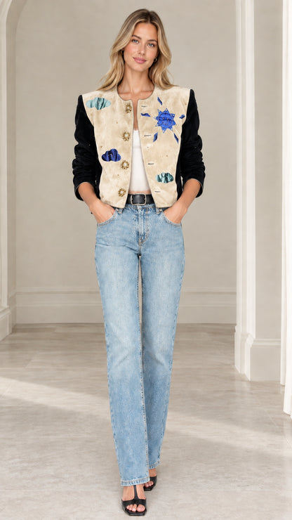 Model wearing beige celestial applique cropped jacket with black velvet sleeves
