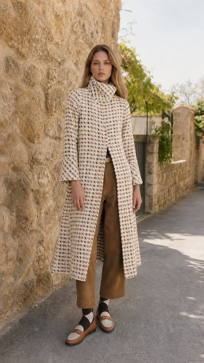 Model wearing cream off-white textured tweed stand collar long coat