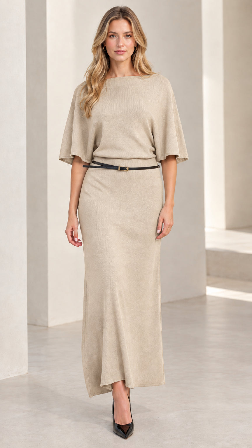 Front view of woman wearing neutral beige oatmeal belted knit maxi dress
