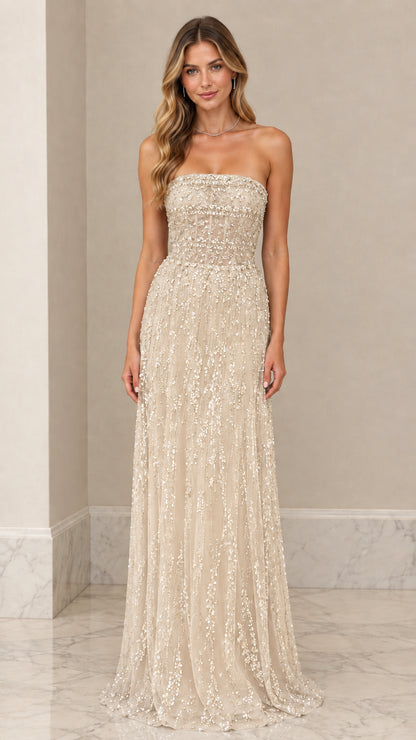 Front view of model wearing Champagne gold strapless beaded evening dress
