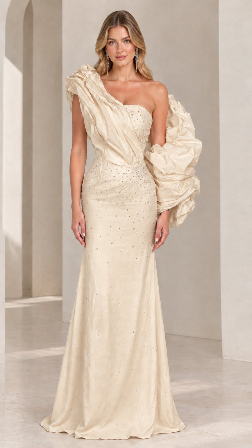 Champagne ivory one-shoulder evening gown with statement ruffled shoulder