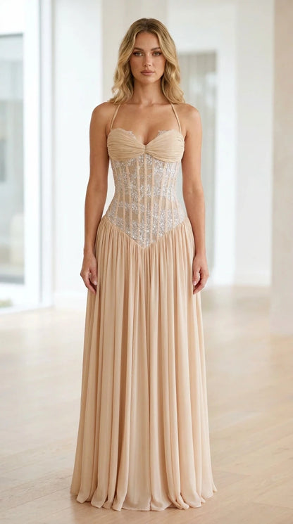 Front view of champagne halter neck sequin corset long dress