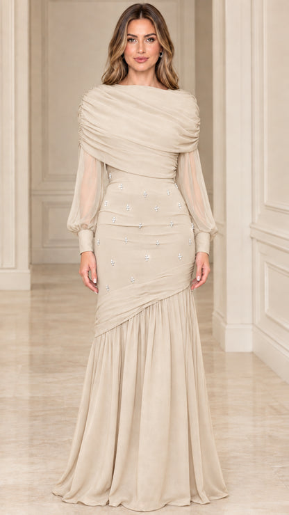 Model wearing champagne beige draped formal evening dress