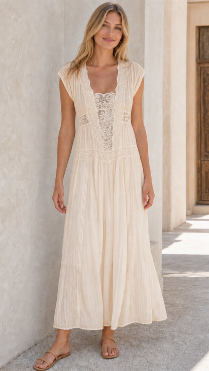 Woman wearing beige sleeveless lace panel maxi dress