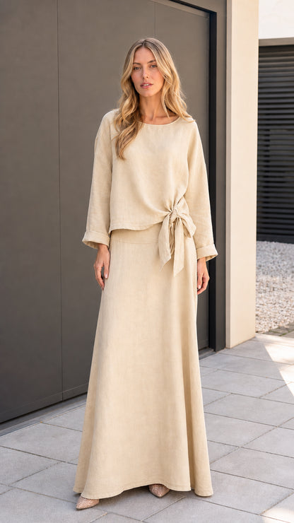 Model wearing beige two-piece matching set