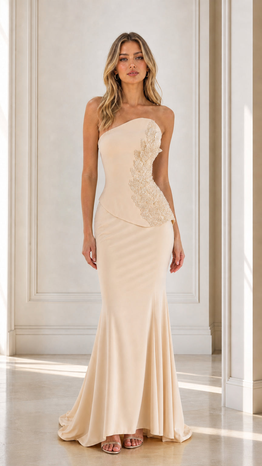 Front view of champagne strapless beaded mermaid evening dress