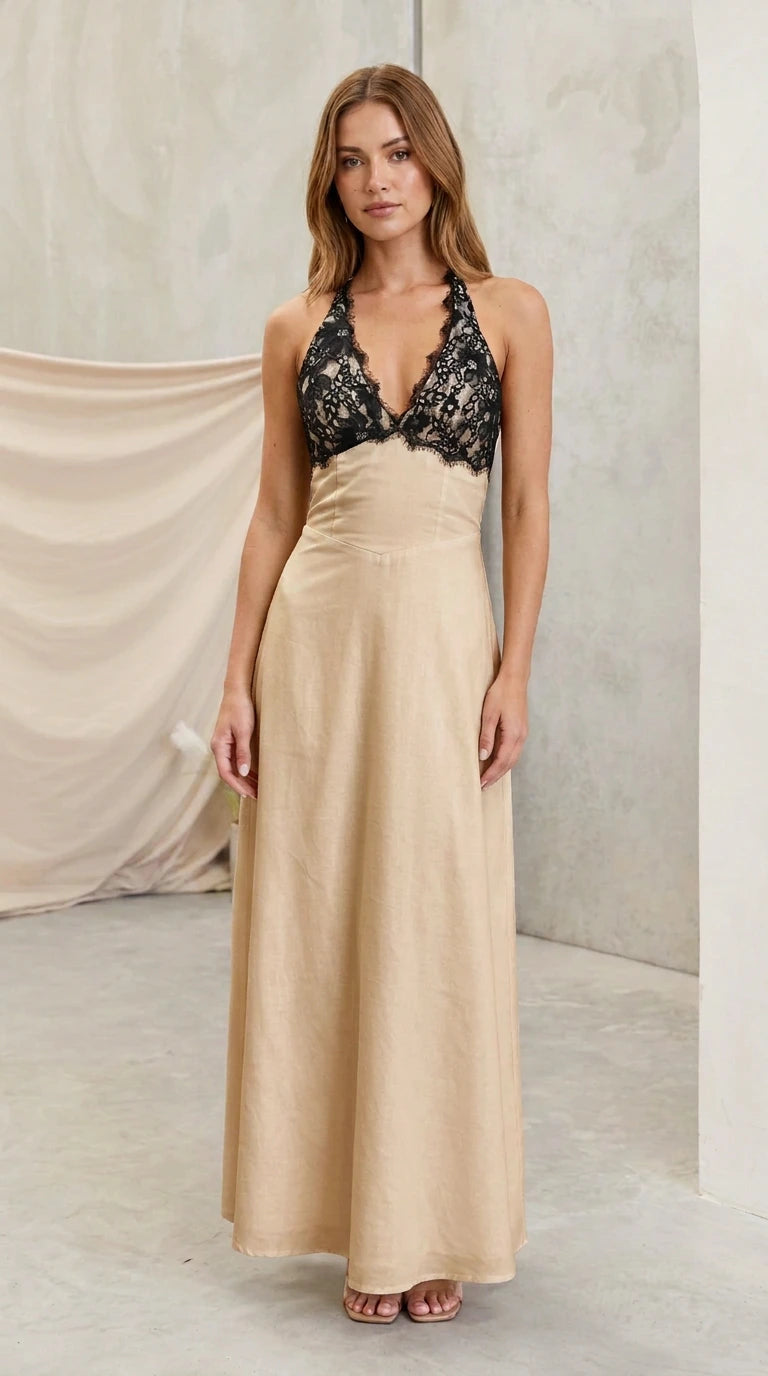 Model wearing champagne beige halter maxi dress with black lace bust