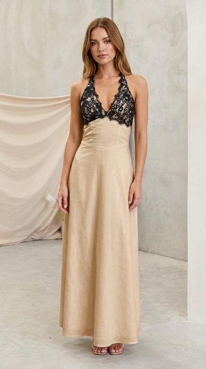 Model wearing champagne beige halter maxi dress with black lace bust
