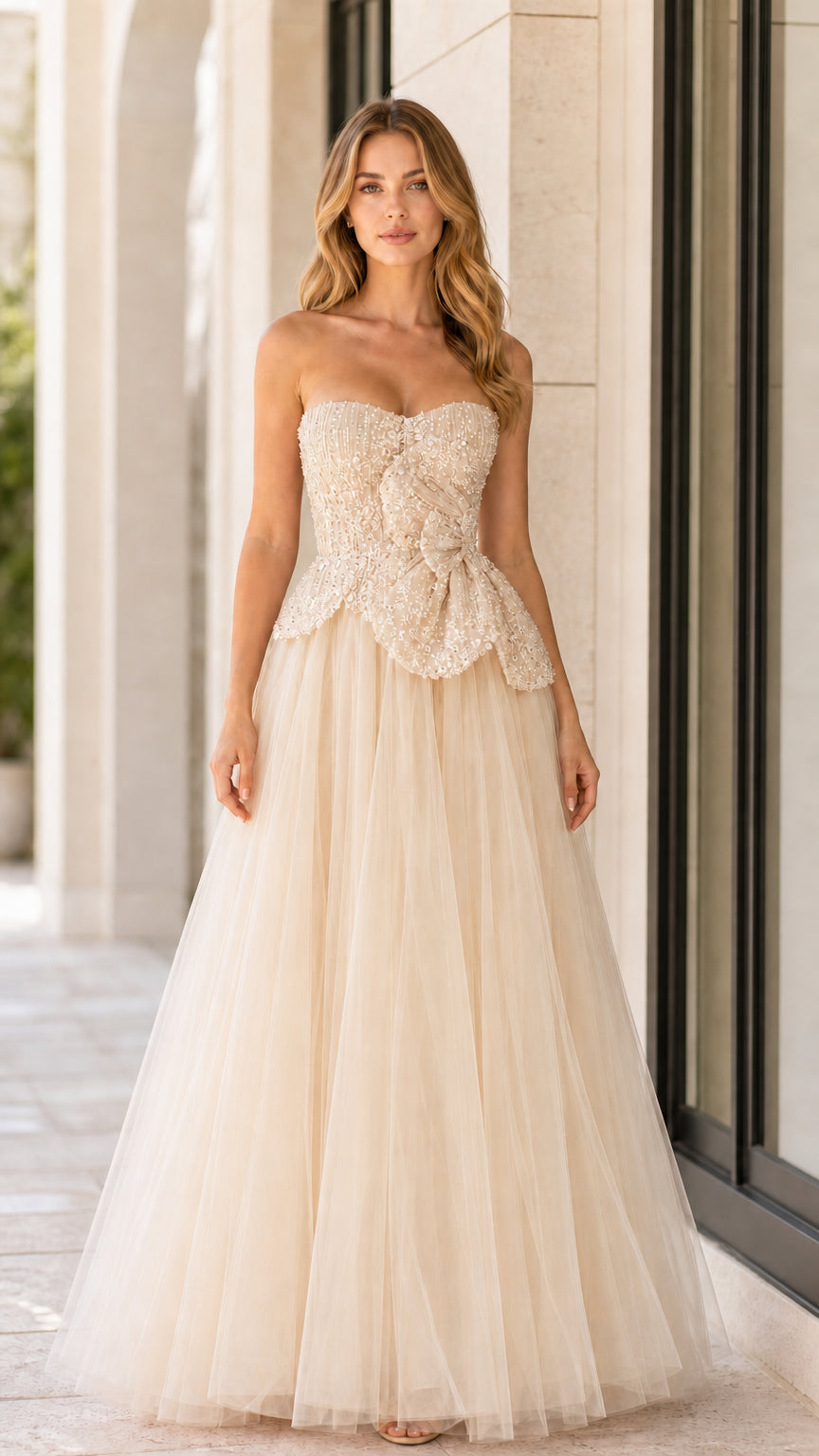 Front full-length view of champagne strapless beaded tulle ball gown