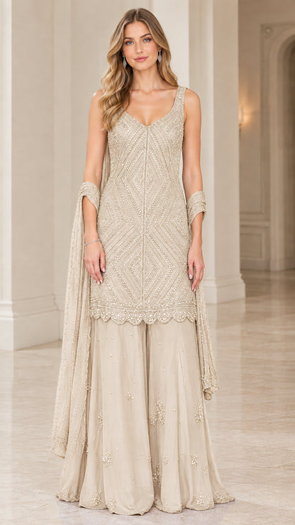 Model wearing Champagne beige embellished sleeveless sharara suit set
