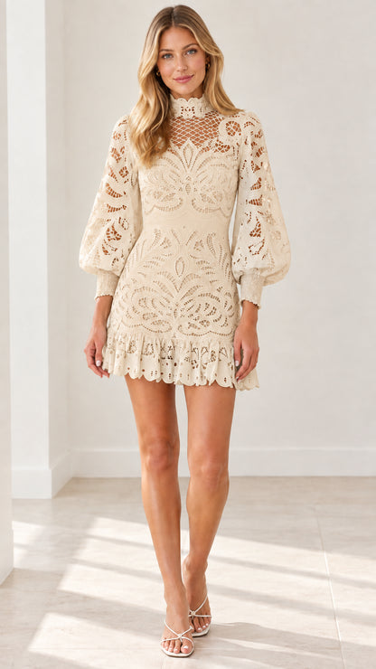Front view of model wearing Cream high neck eyelet lace mini dress