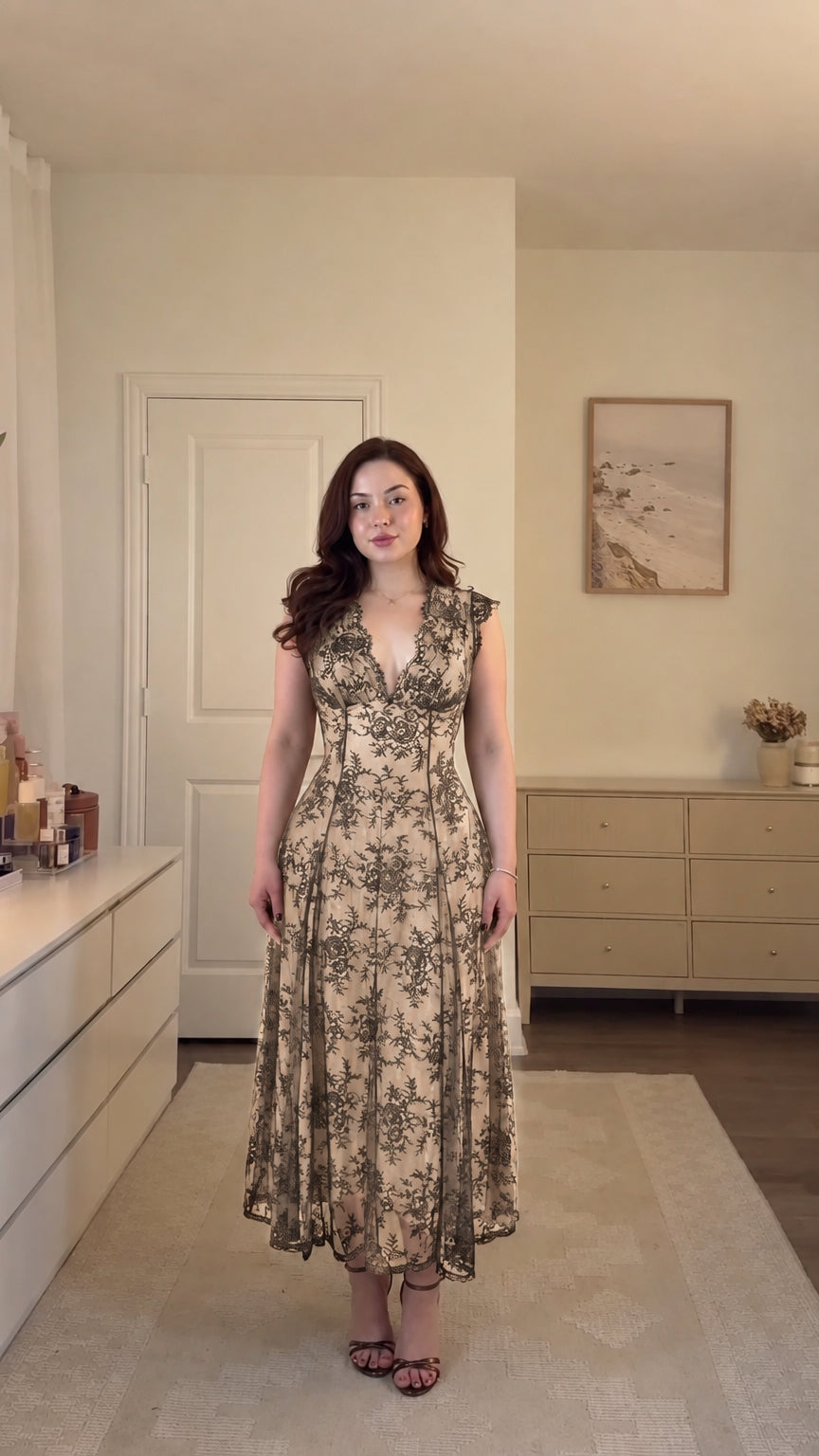 Model wearing champagne gold floral lace corset midi dress