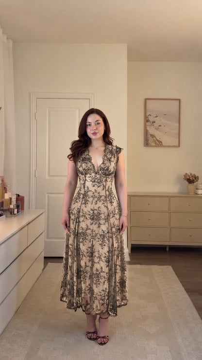 Model wearing champagne gold floral lace corset midi dress