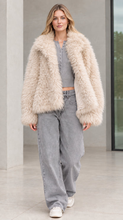Front view of model wearing cream beige shaggy faux fur jacket