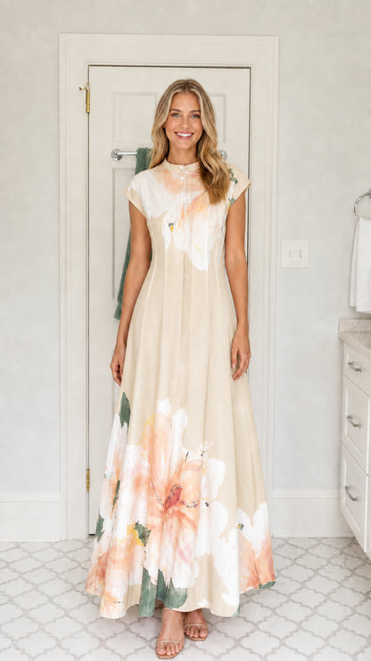 Front view of woman wearing beige cream watercolor floral button placket maxi dress