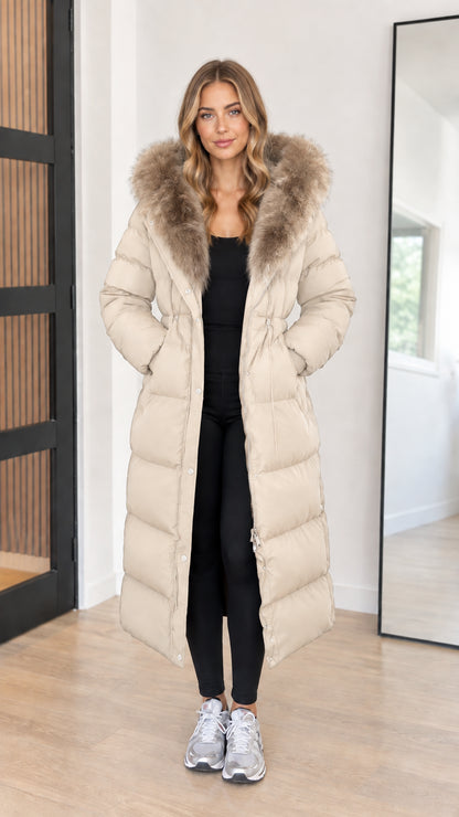Full length view of women's beige cream maxi insulated puffer parka coat