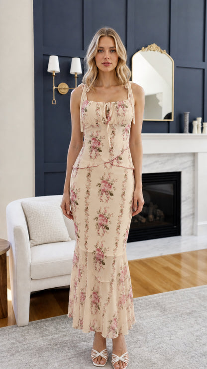Front view of woman wearing beige floral midi dress