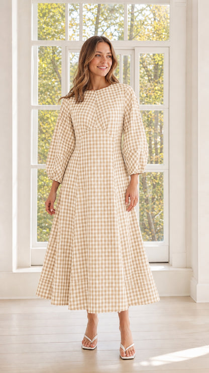 Woman wearing beige gingham midi dress