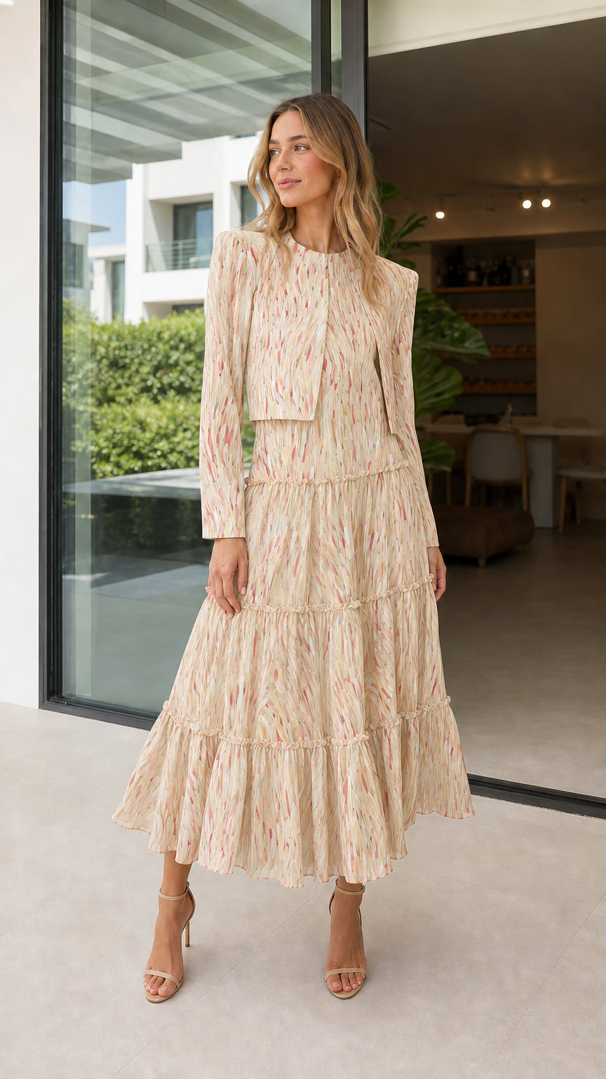 Model wearing beige abstract print tiered midi dress