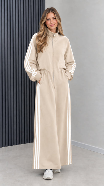 Front view of model wearing beige sand zip front sporty maxi dress