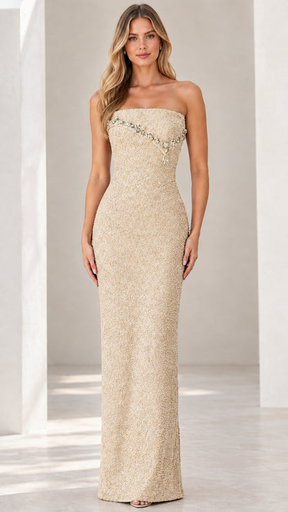 Front view of champagne strapless beaded column evening gown