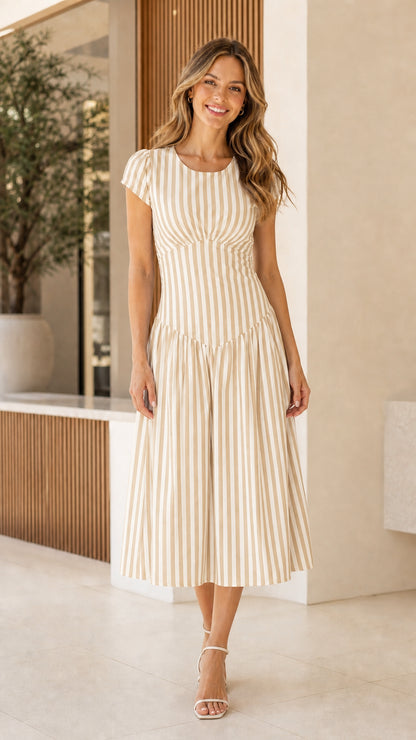 Woman wearing beige striped midi dress